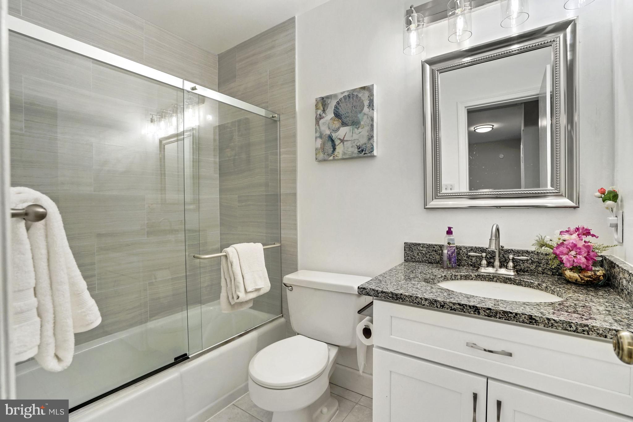 9421 Reach Road Potomac, MD 20854 - Photo 38 of 54 Renovated hall bath- tub/shower combo