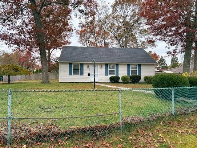 a view of a dining room with furniture and window