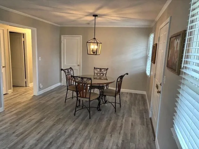 a kitchen with a refrigerator and a stove top oven