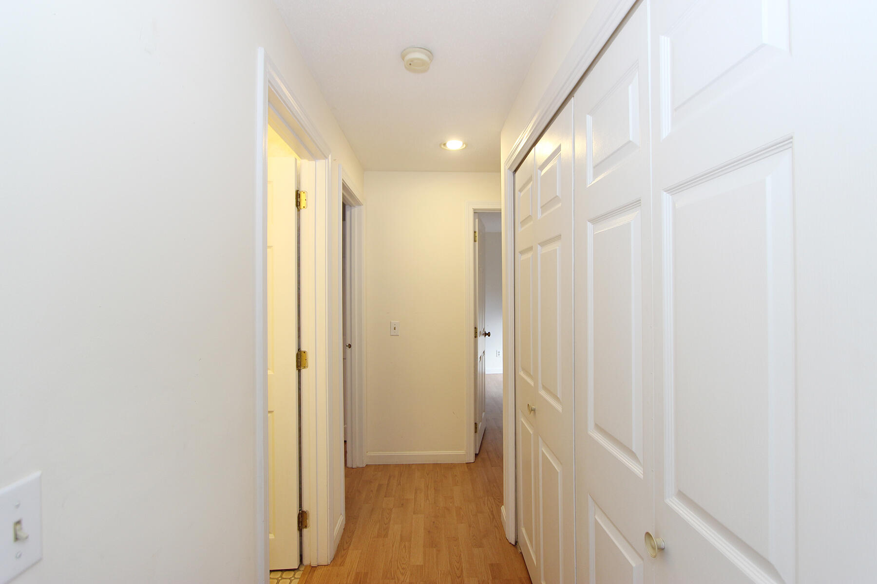 222 Buck Island Road, Unit 53 West Yarmouth, MA 02673 - Photo 11 of 23 a view of a hallway with wooden floor
