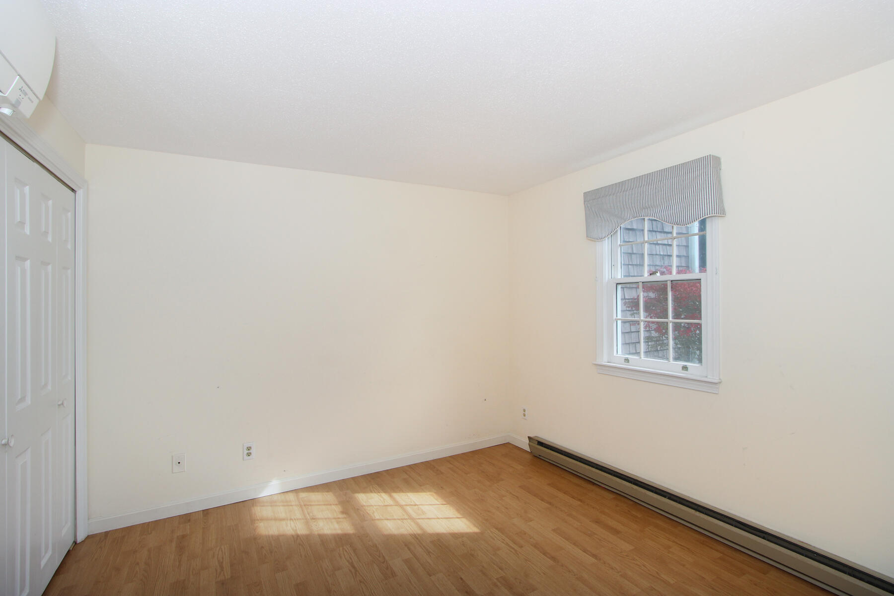 222 Buck Island Road, Unit 53 West Yarmouth, MA 02673 - Photo 16 of 23 an empty room with a window