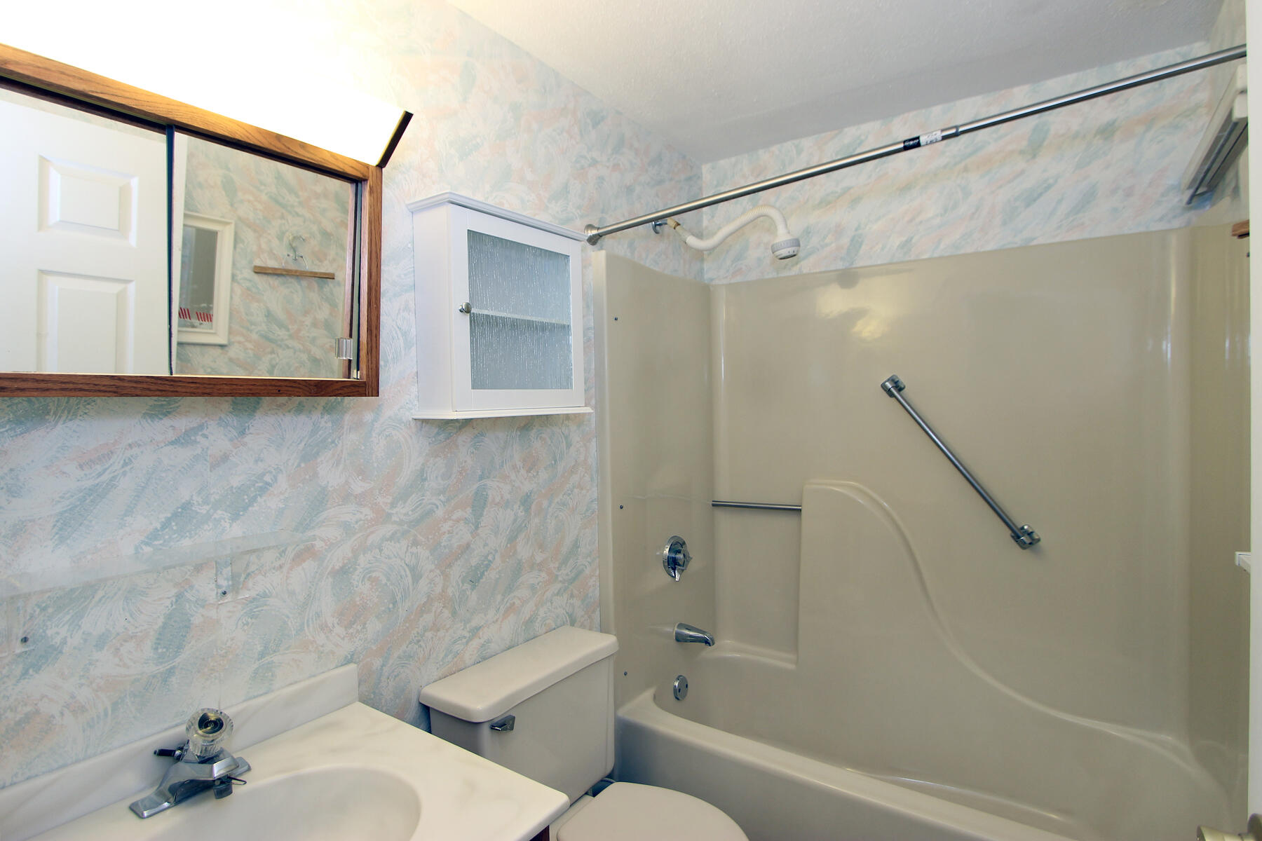 222 Buck Island Road, Unit 53 West Yarmouth, MA 02673 - Photo 18 of 23 a bathroom with a shower a toilet and a sink