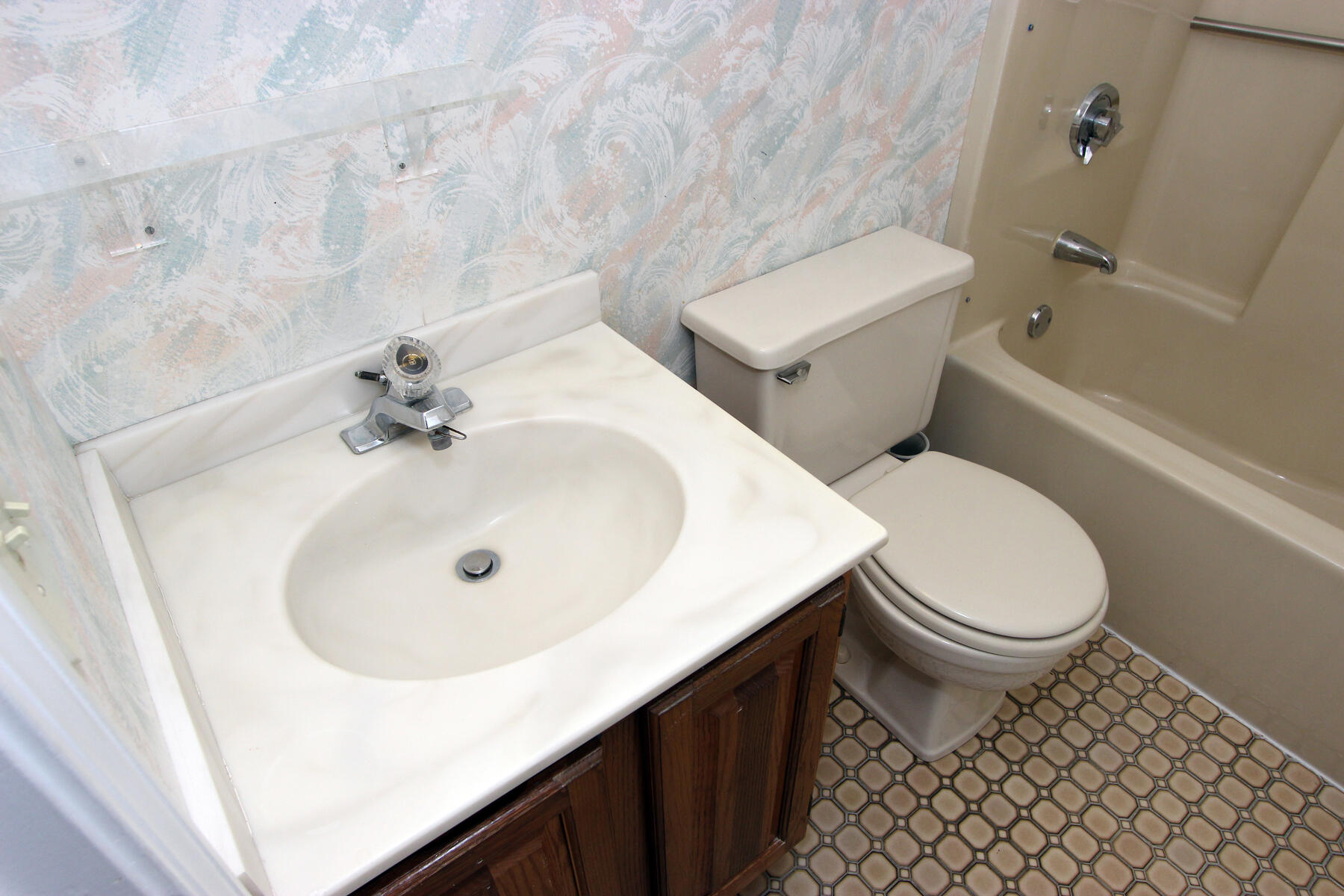 222 Buck Island Road, Unit 53 West Yarmouth, MA 02673 - Photo 19 of 23 a white toilet sitting next to a bathroom sink