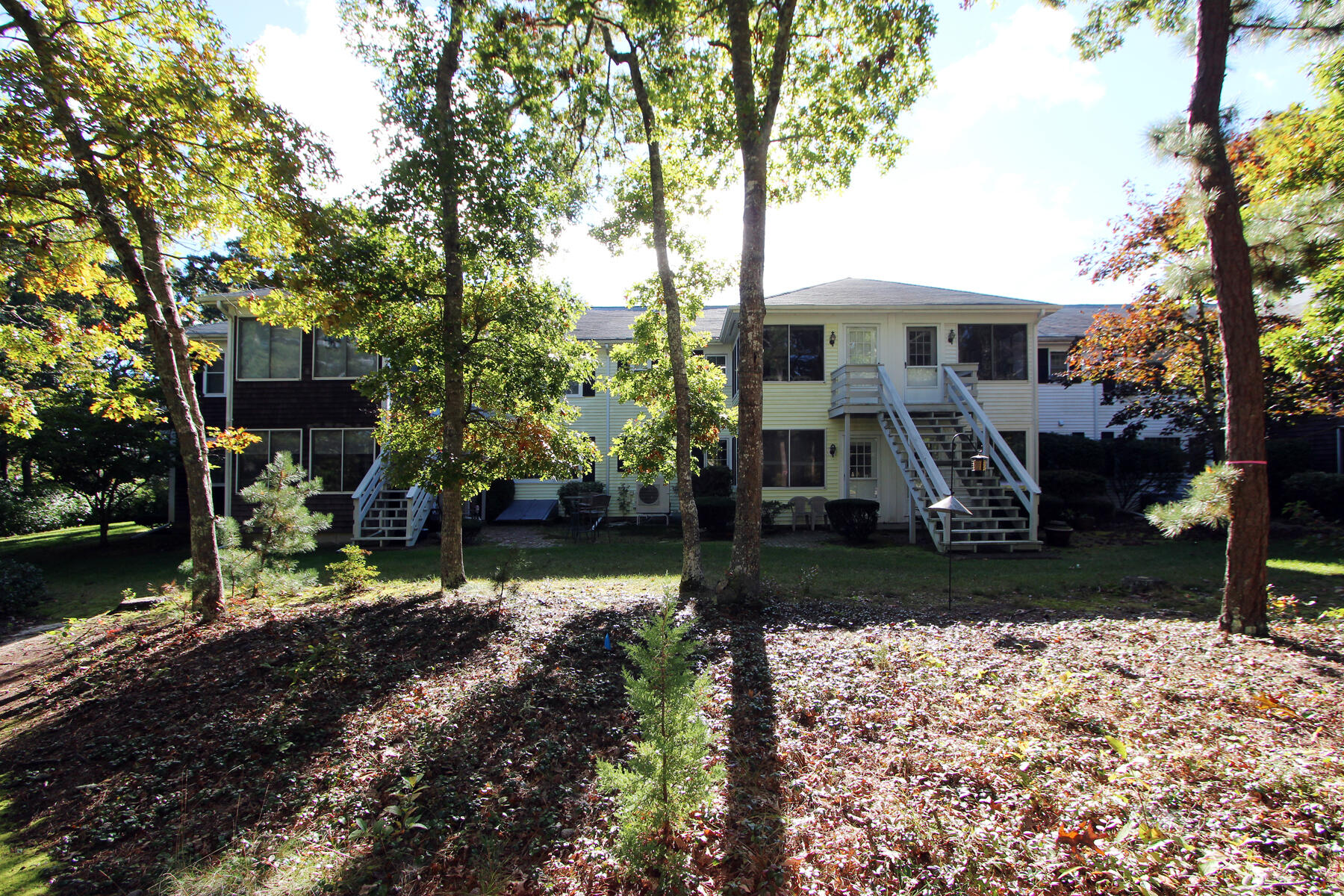 222 Buck Island Road, Unit 53 West Yarmouth, MA 02673 - Photo 20 of 23 a front view of a house with garden
