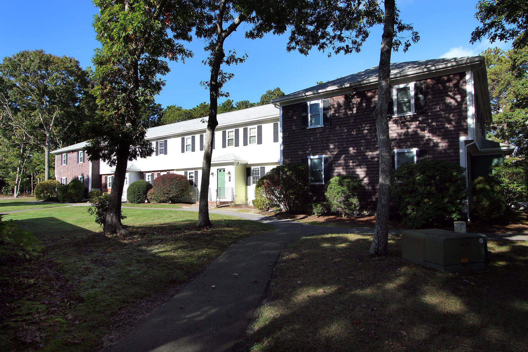 222 Buck Island Road, Unit 53 West Yarmouth, MA 02673 - Photo 4 of 23 a view of a street with a building and a street light