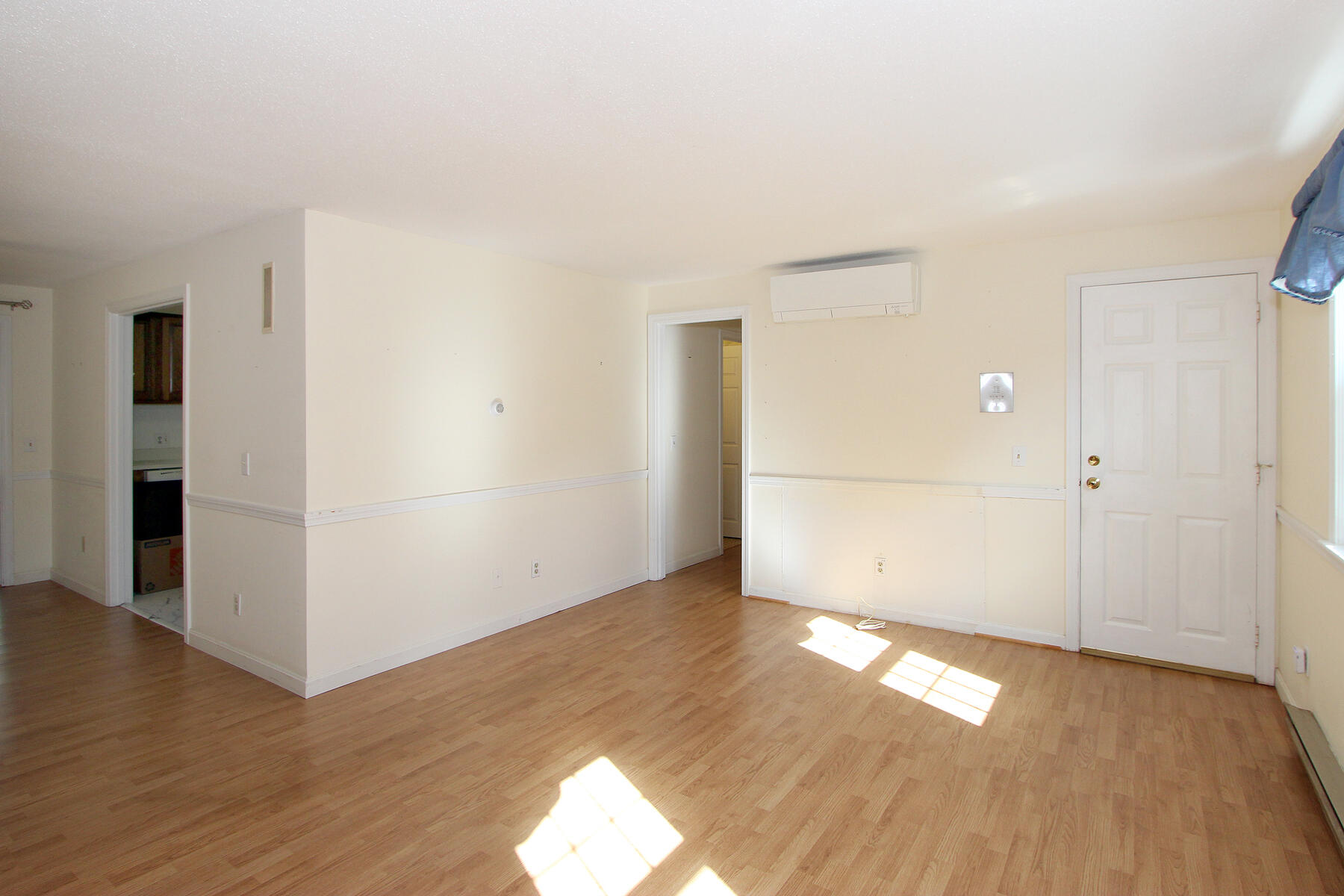 222 Buck Island Road, Unit 53 West Yarmouth, MA 02673 - Photo 6 of 23 an empty room with wooden floor