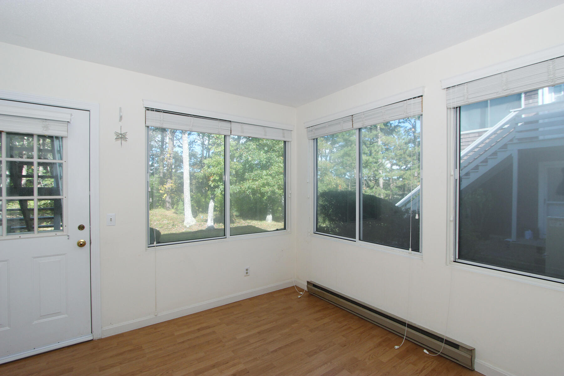 222 Buck Island Road, Unit 53 West Yarmouth, MA 02673 - Photo 10 of 23 a view of an empty room with a window