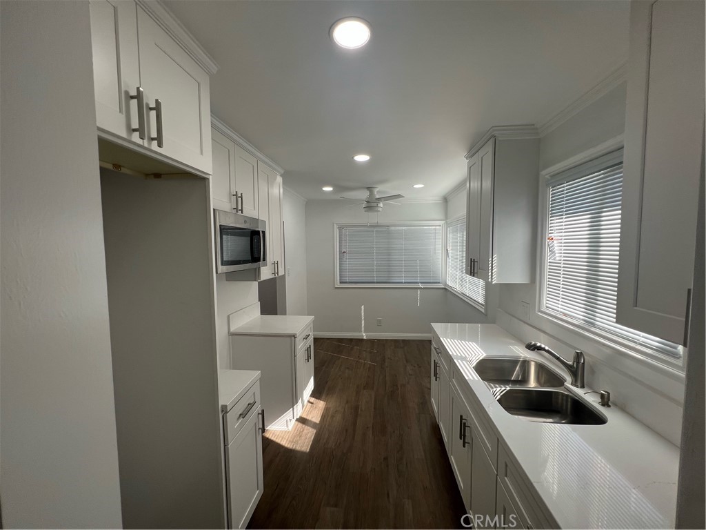 a kitchen with a sink and a refrigerator