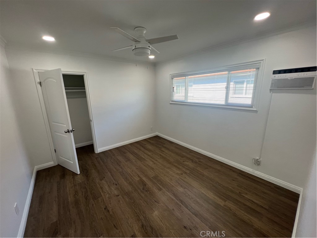 417 North 7th Street Montebello, CA 90640 - Photo 12 of 15 an empty room with wooden floor and windows