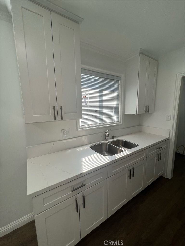417 North 7th Street Montebello, CA 90640 - Photo 2 of 15 a kitchen with stainless steel appliances granite countertop a sink and a stove
