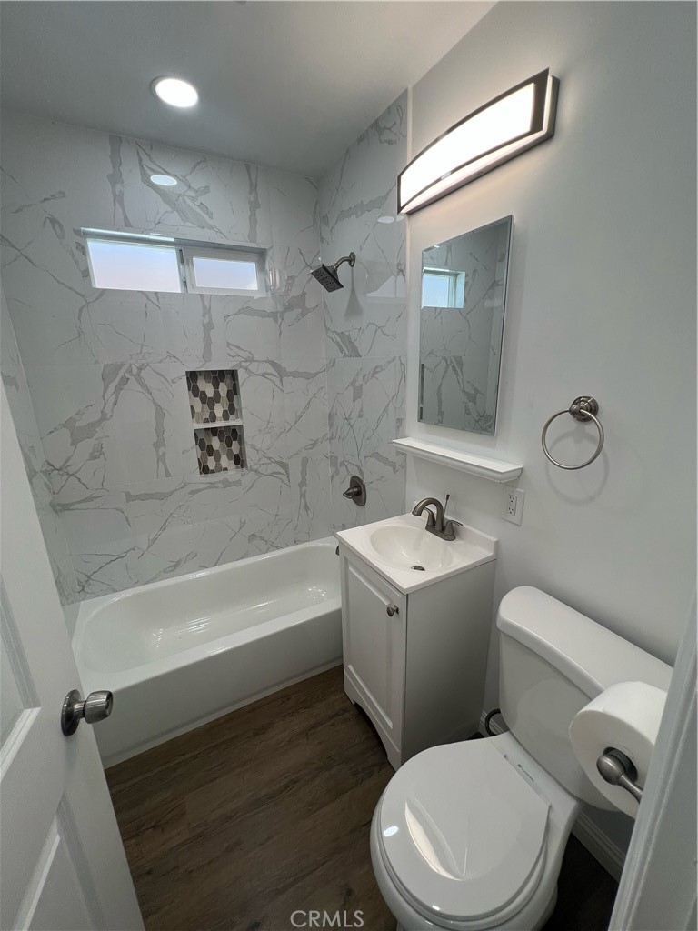 417 North 7th Street Montebello, CA 90640 - Photo 6 of 15 a bathroom with a sink a toilet and shower