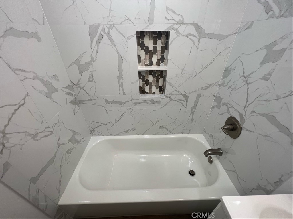 417 North 7th Street Montebello, CA 90640 - Photo 7 of 15 a bathroom with a bathtub
