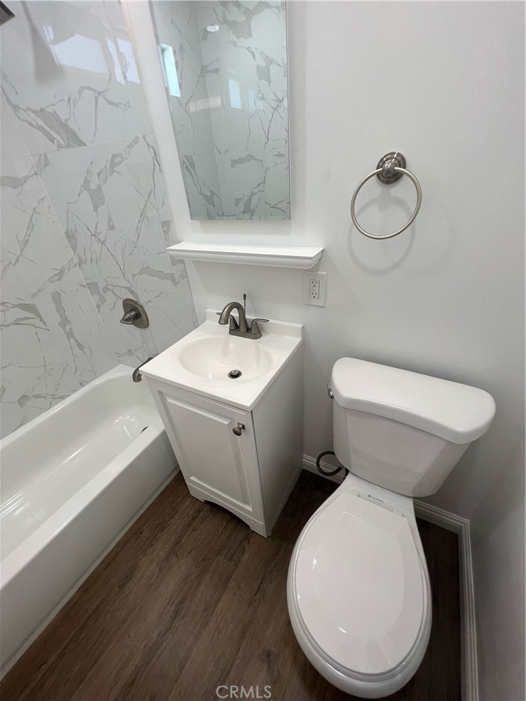 417 North 7th Street Montebello, CA 90640 - Photo 8 of 15 a bathroom with a toilet sink and mirror