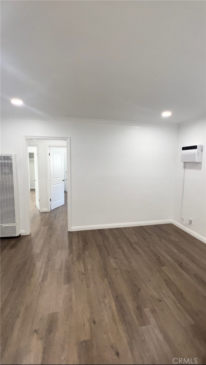 417 North 7th Street Montebello, CA 90640 - Photo 9 of 15 an empty room with wooden floor and windows