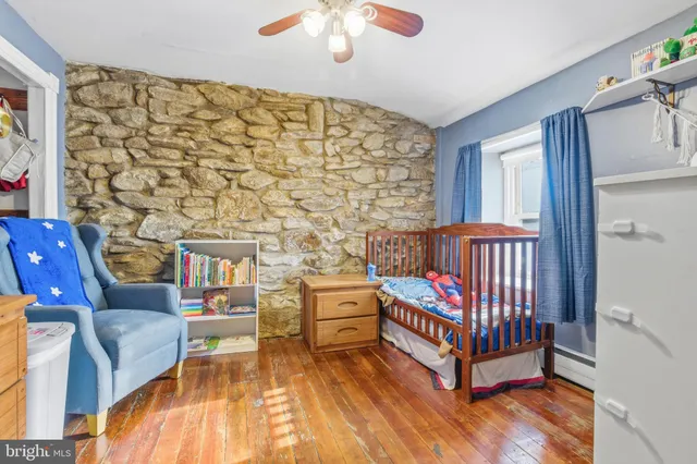 a bedroom with furniture and a window