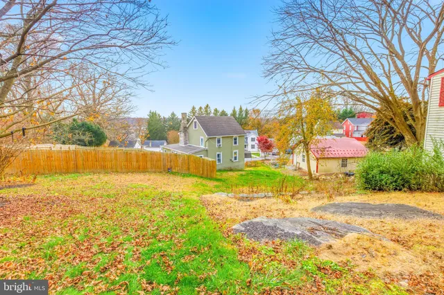 a view of an swimming pool with an outdoor space and seating area