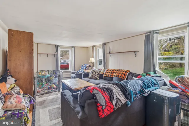 a bedroom with two beds and a window