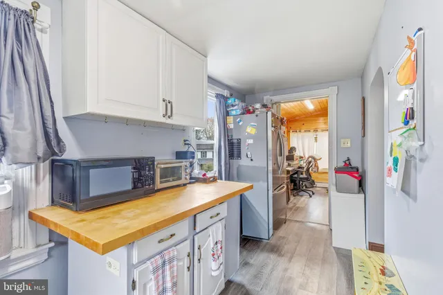 a room with furniture a flat screen tv and a table