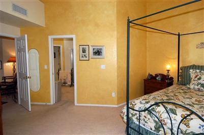 4992 North Valle Road Tucson, AZ 85750 - Photo 5 of 10 a bed room with a bed and a walk in closet