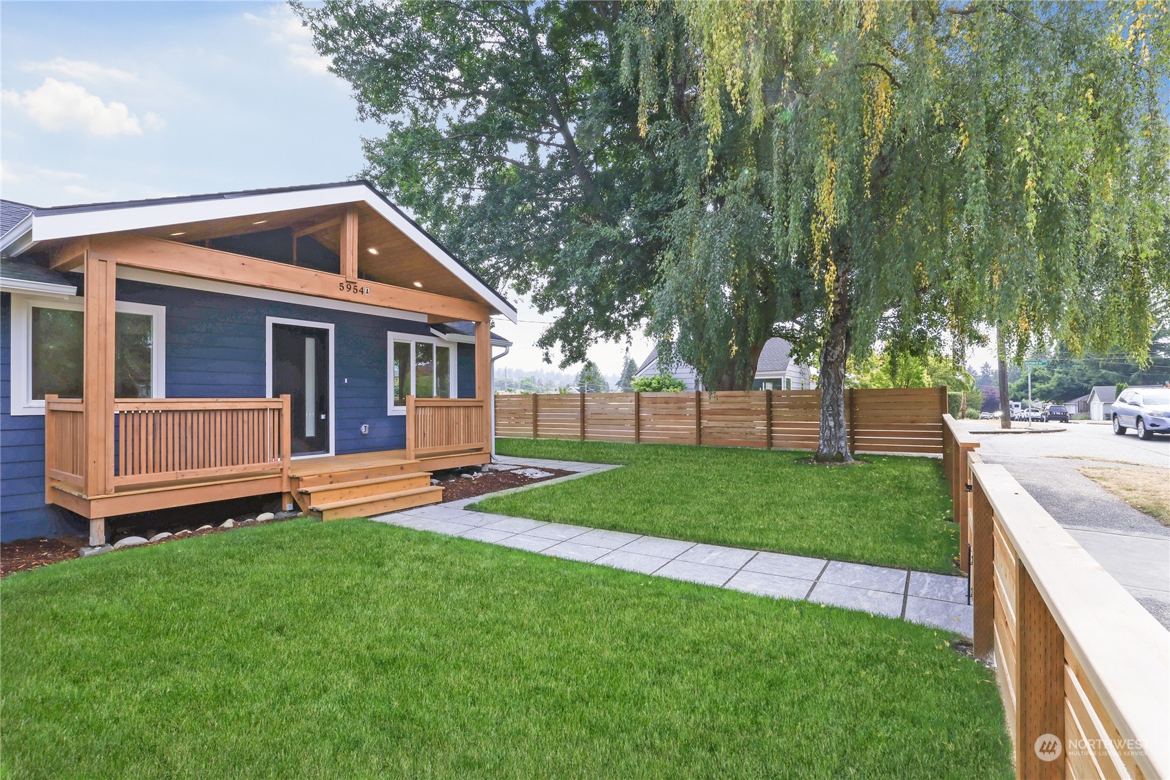 5954 49th Avenue Southwest, Unit A Seattle, WA 98136 - Photo 2 of 12 a front view of house with yard and green space