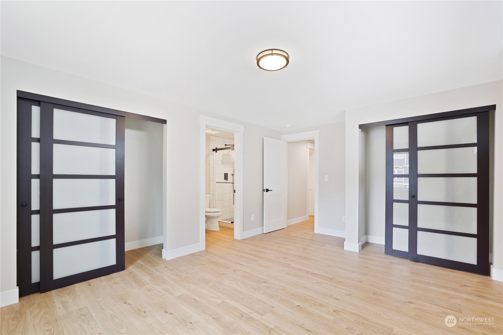 5954 49th Avenue Southwest, Unit A Seattle, WA 98136 - Photo 9 of 12 an empty room with closet