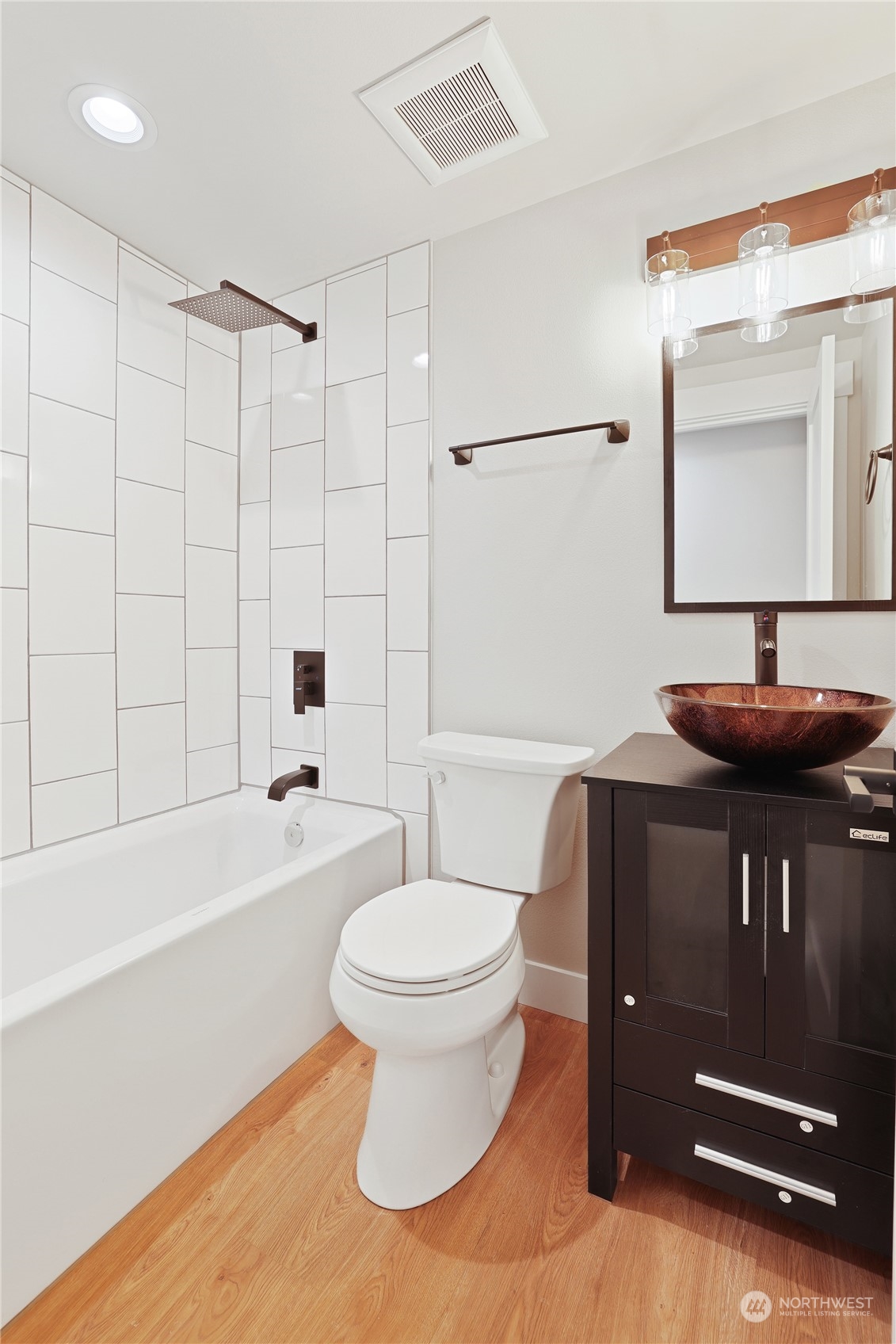 5954 49th Avenue Southwest, Unit A Seattle, WA 98136 - Photo 10 of 12 a bathroom with a sink a toilet and a bathtub