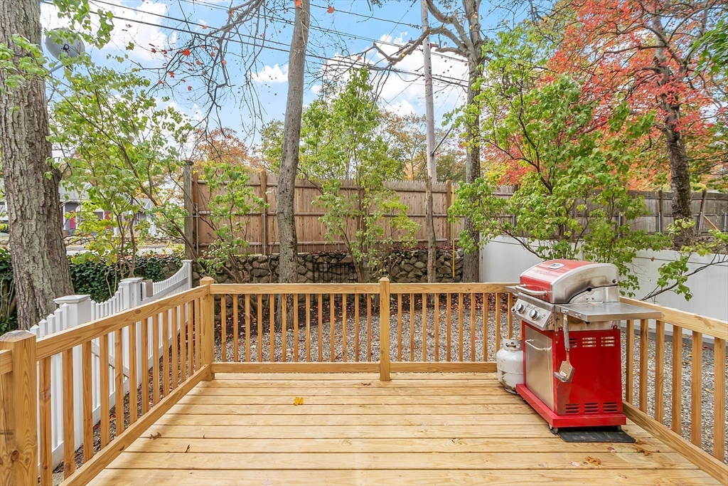2 Cedarwood Road Lynnfield, MA 01940 - Photo 16 of 40 a view of a chairs on the deck