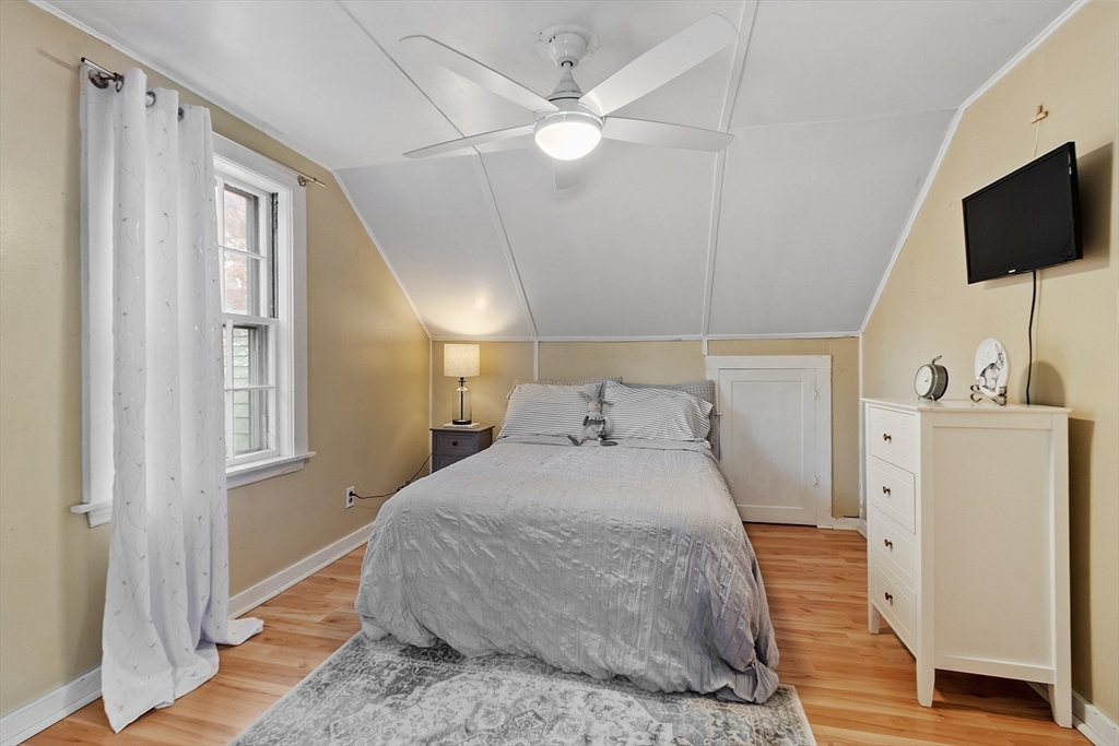 2 Cedarwood Road Lynnfield, MA 01940 - Photo 21 of 40 a bedroom with a bed and a flat screen tv