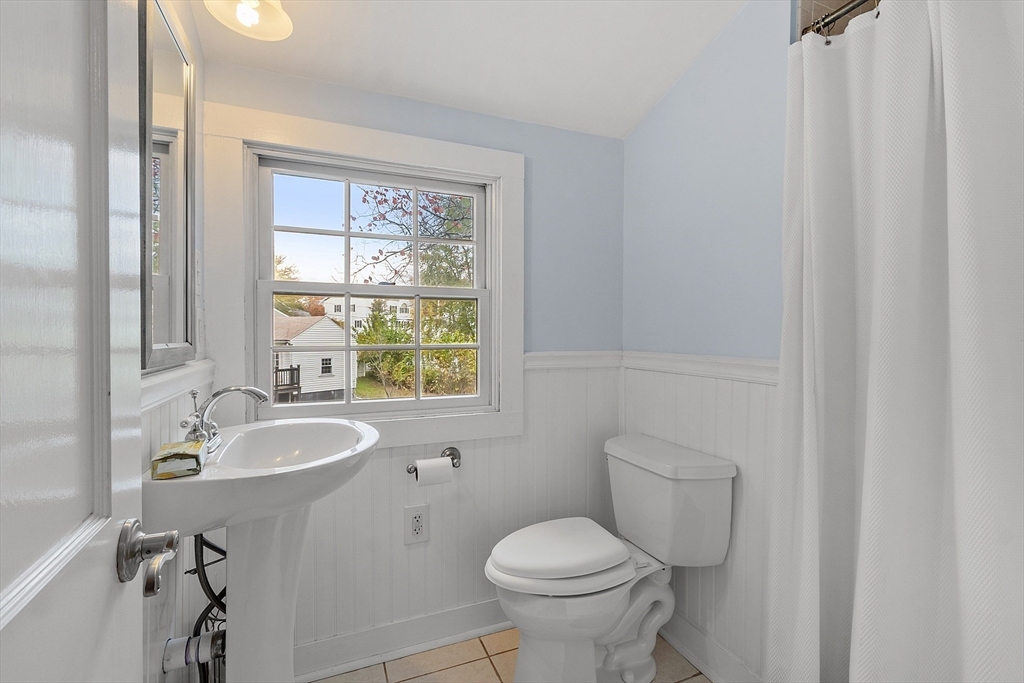 2 Cedarwood Road Lynnfield, MA 01940 - Photo 32 of 40 a bathroom with a granite countertop sink toilet and mirror