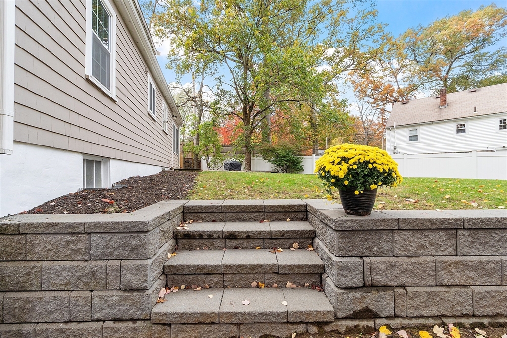 2 Cedarwood Road Lynnfield, MA 01940 - Photo 37 of 40 a front view of a house with garden