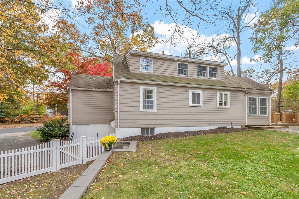2 Cedarwood Road Lynnfield, MA 01940 - Photo 38 of 40 a backyard of a house with table and chairs
