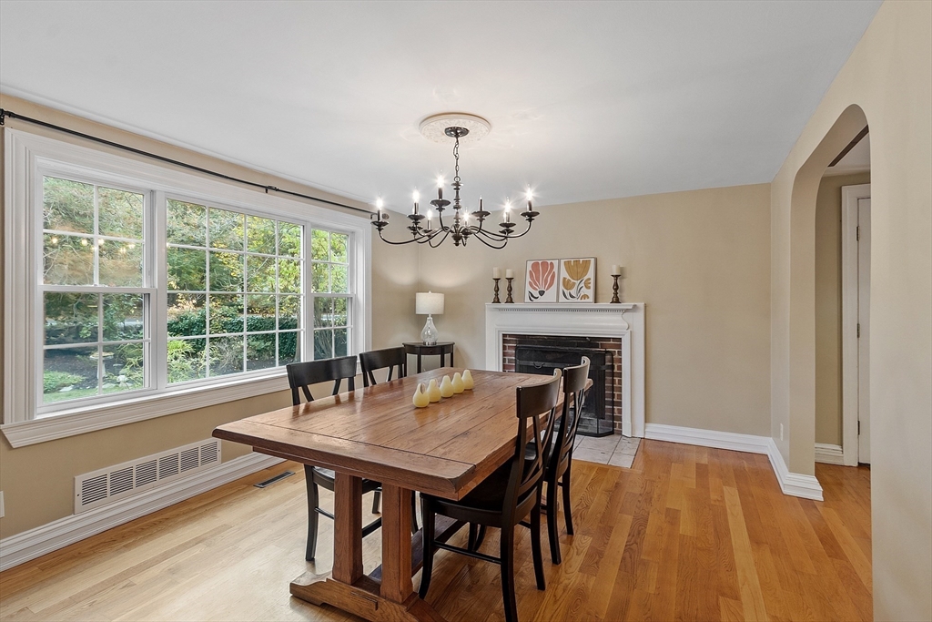 2 Cedarwood Road Lynnfield, MA 01940 - Photo 5 of 40 a view of a dining room with furniture a chandelier and wooden floor