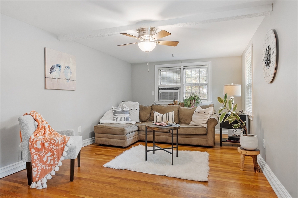 2 Cedarwood Road Lynnfield, MA 01940 - Photo 8 of 40 a living room with furniture and a chandelier