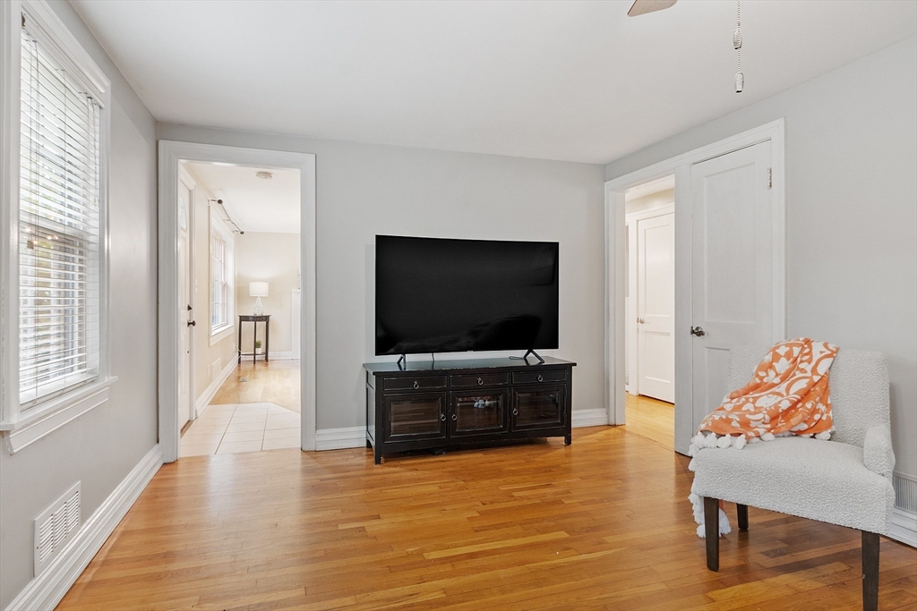 2 Cedarwood Road Lynnfield, MA 01940 - Photo 9 of 40 a living room with furniture and a flat screen tv