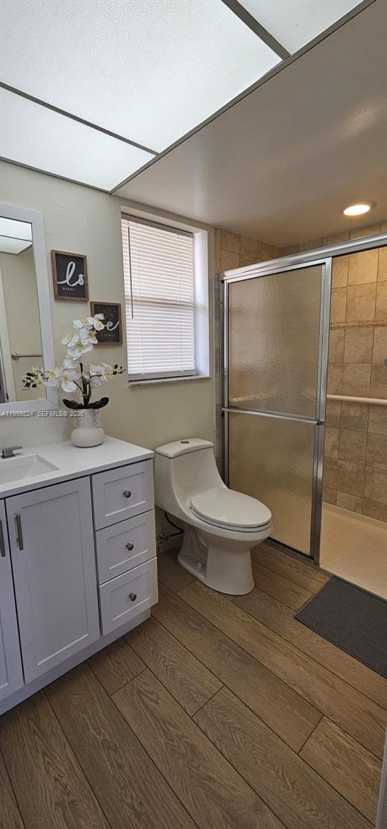 2801 North Pine Island Road, Unit 207 Sunrise, FL 33322 - Photo 2 of 11 a bathroom with a granite countertop sink toilet and shower