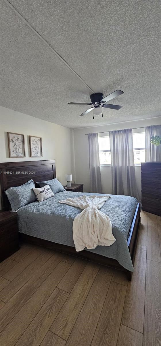 2801 North Pine Island Road, Unit 207 Sunrise, FL 33322 - Photo 3 of 11 a bedroom with a bed and window