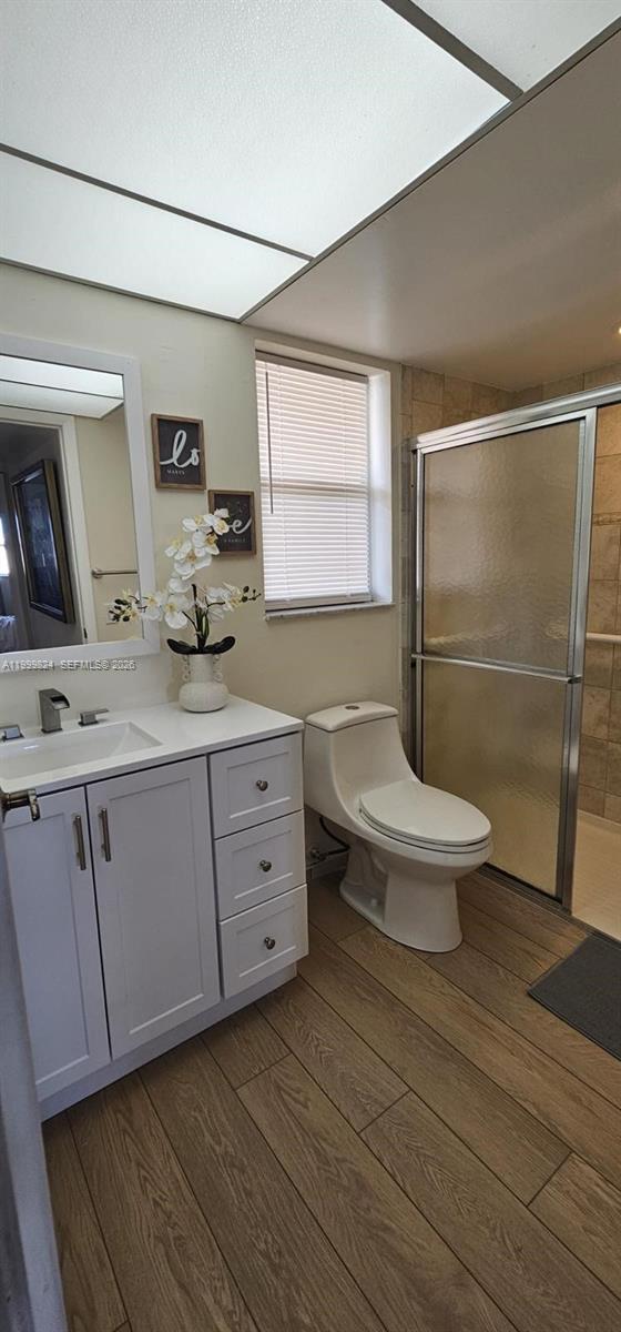 2801 North Pine Island Road, Unit 207 Sunrise, FL 33322 - Photo 7 of 11 a bathroom with a granite countertop sink toilet and shower