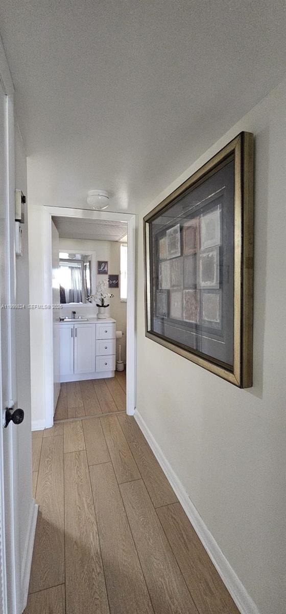 2801 North Pine Island Road, Unit 207 Sunrise, FL 33322 - Photo 8 of 11 a big room with chandelier fan and windows