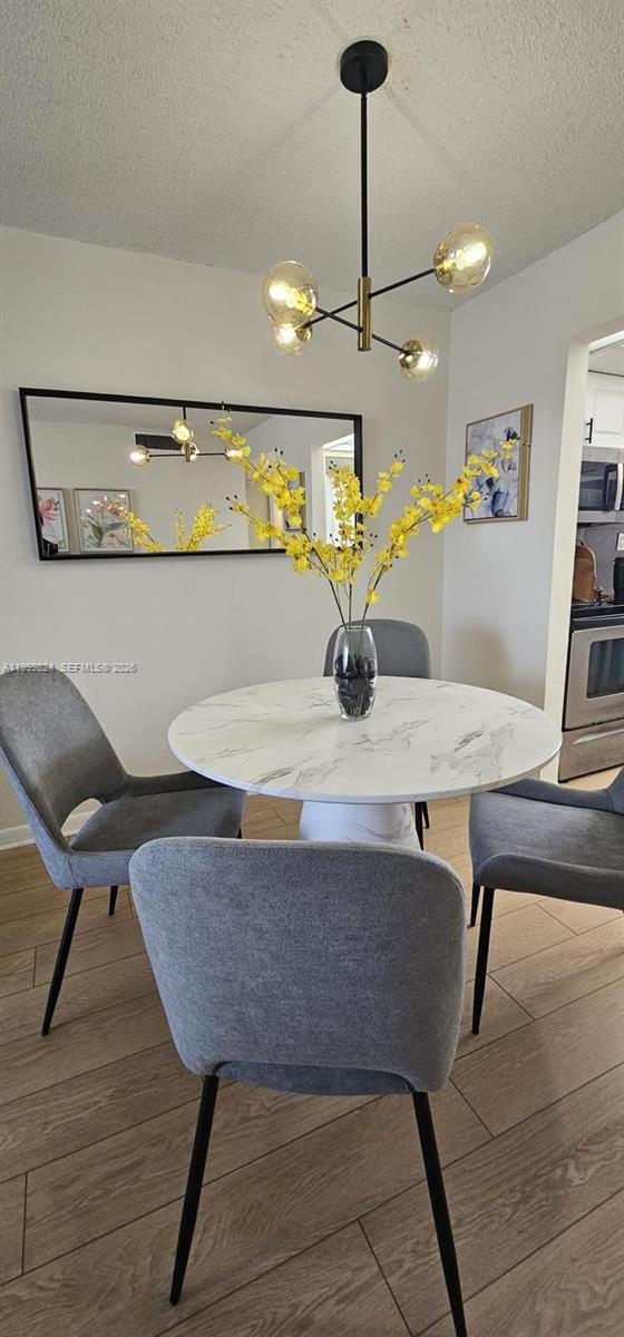 2801 North Pine Island Road, Unit 207 Sunrise, FL 33322 - Photo 10 of 11 a view of a dining room with furniture