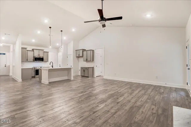 a view of kitchen with cabinets and wooden floor