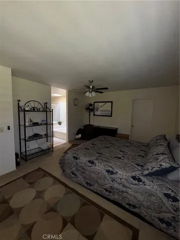 a bedroom with a bed and a stove