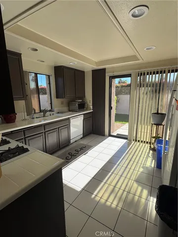 a large bedroom with double vanity sink and a bathtub