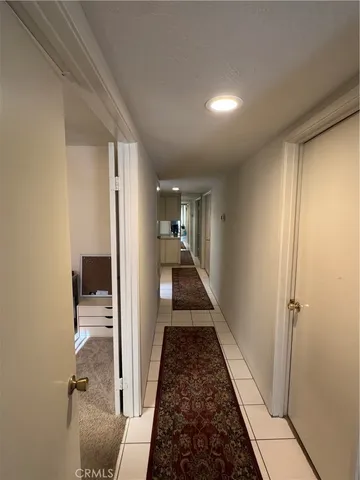 a view of a hallway view with staircase