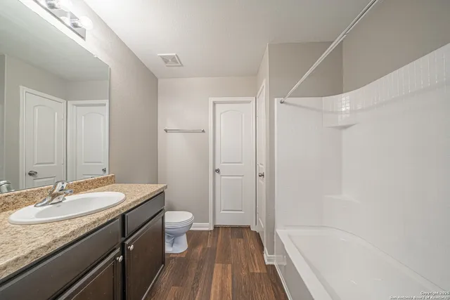 a swimming pool with wooden fence