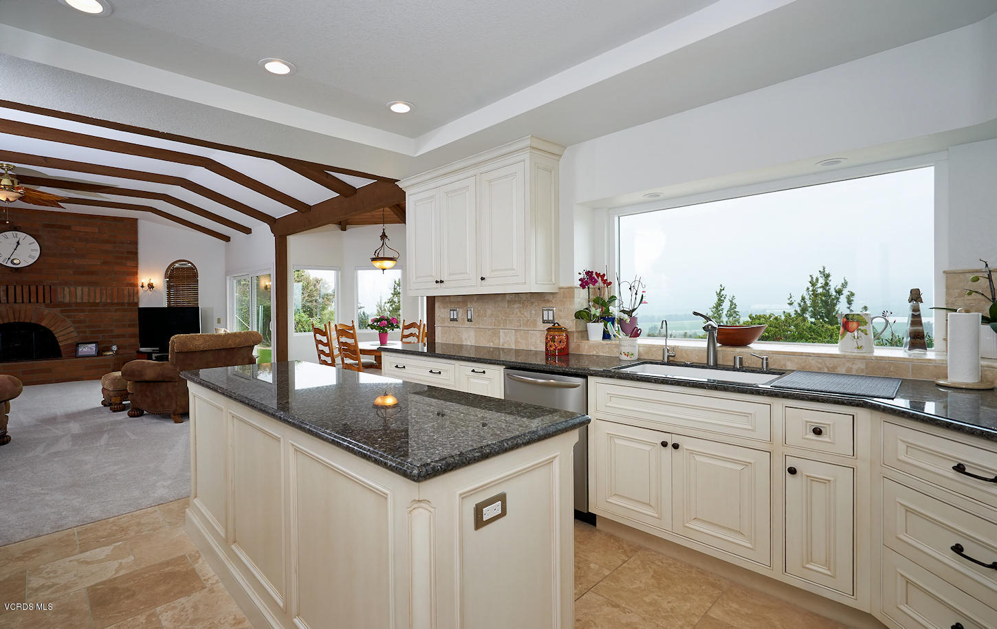 660 Via Con Dios Camarillo, CA 93010 - Photo 11 of 33 a kitchen with granite countertop a sink and white cabinets