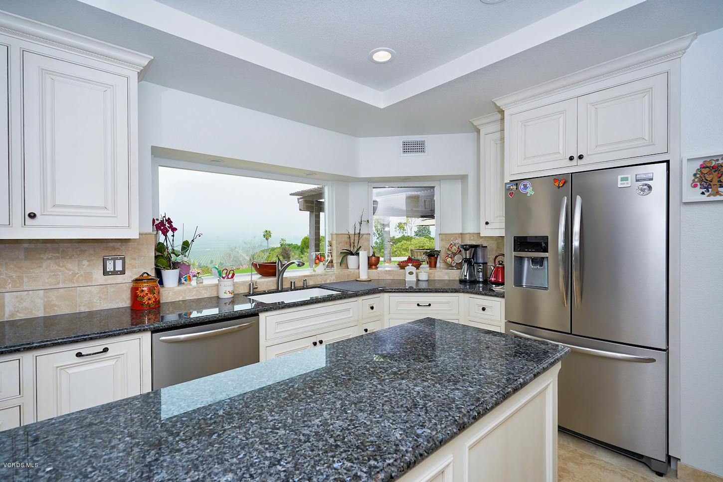 660 Via Con Dios Camarillo, CA 93010 - Photo 12 of 33 a kitchen with a sink refrigerator and cabinets