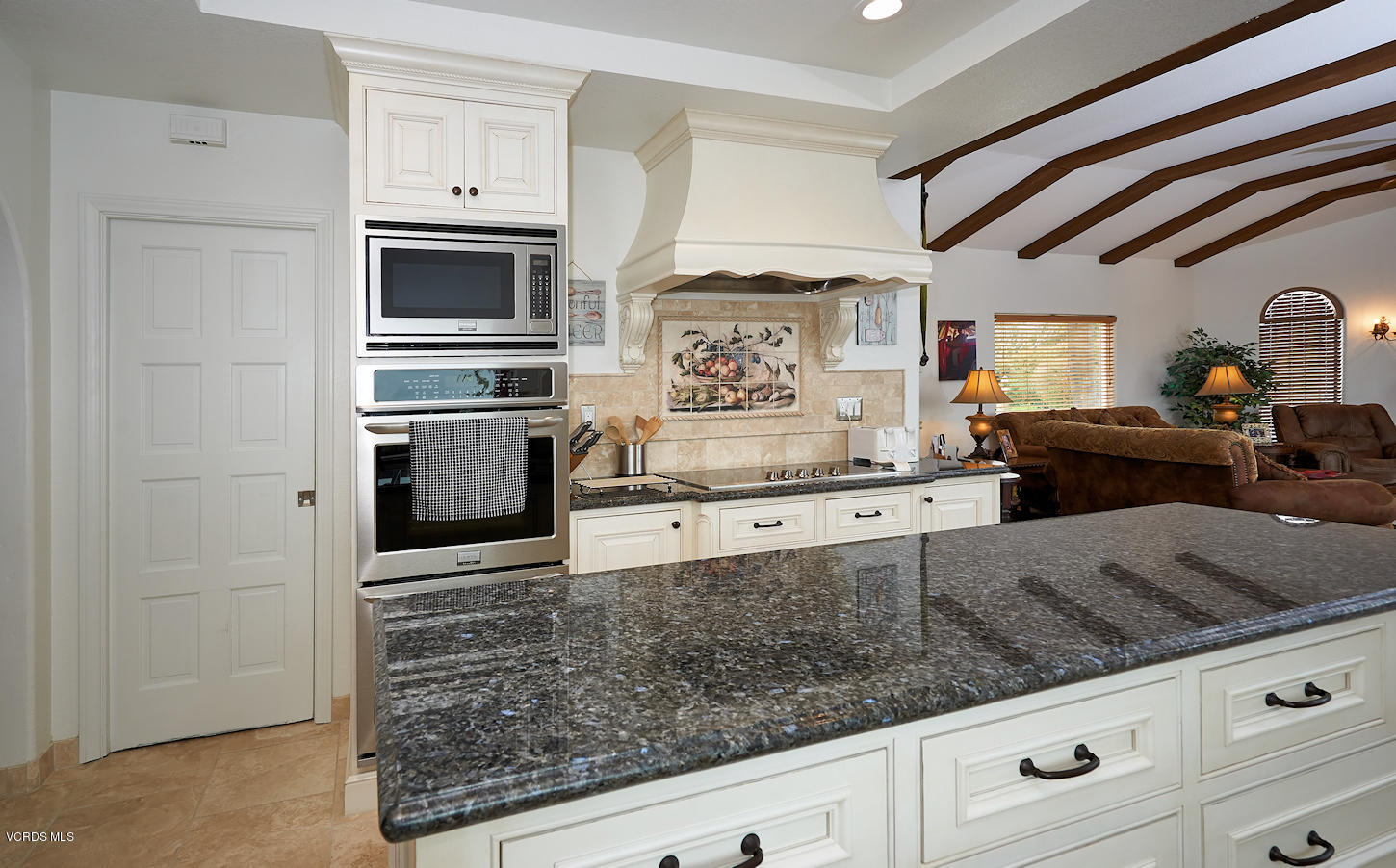 660 Via Con Dios Camarillo, CA 93010 - Photo 13 of 33 a kitchen with stainless steel appliances kitchen island granite countertop a stove and a sink