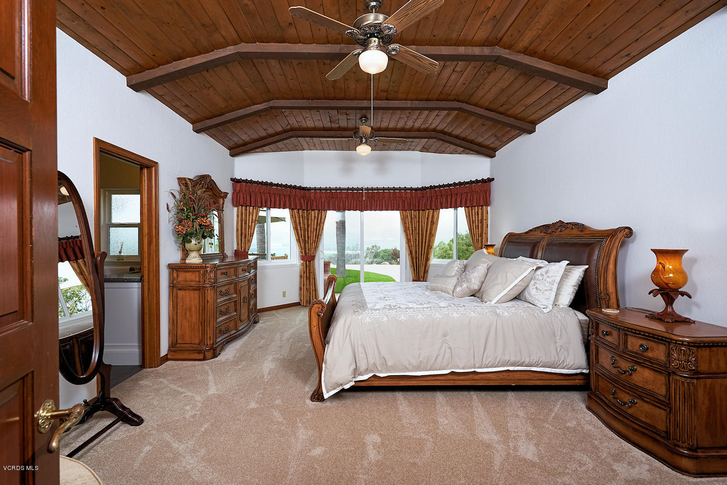 660 Via Con Dios Camarillo, CA 93010 - Photo 18 of 33 a bedroom with a bed a chandelier and balcony