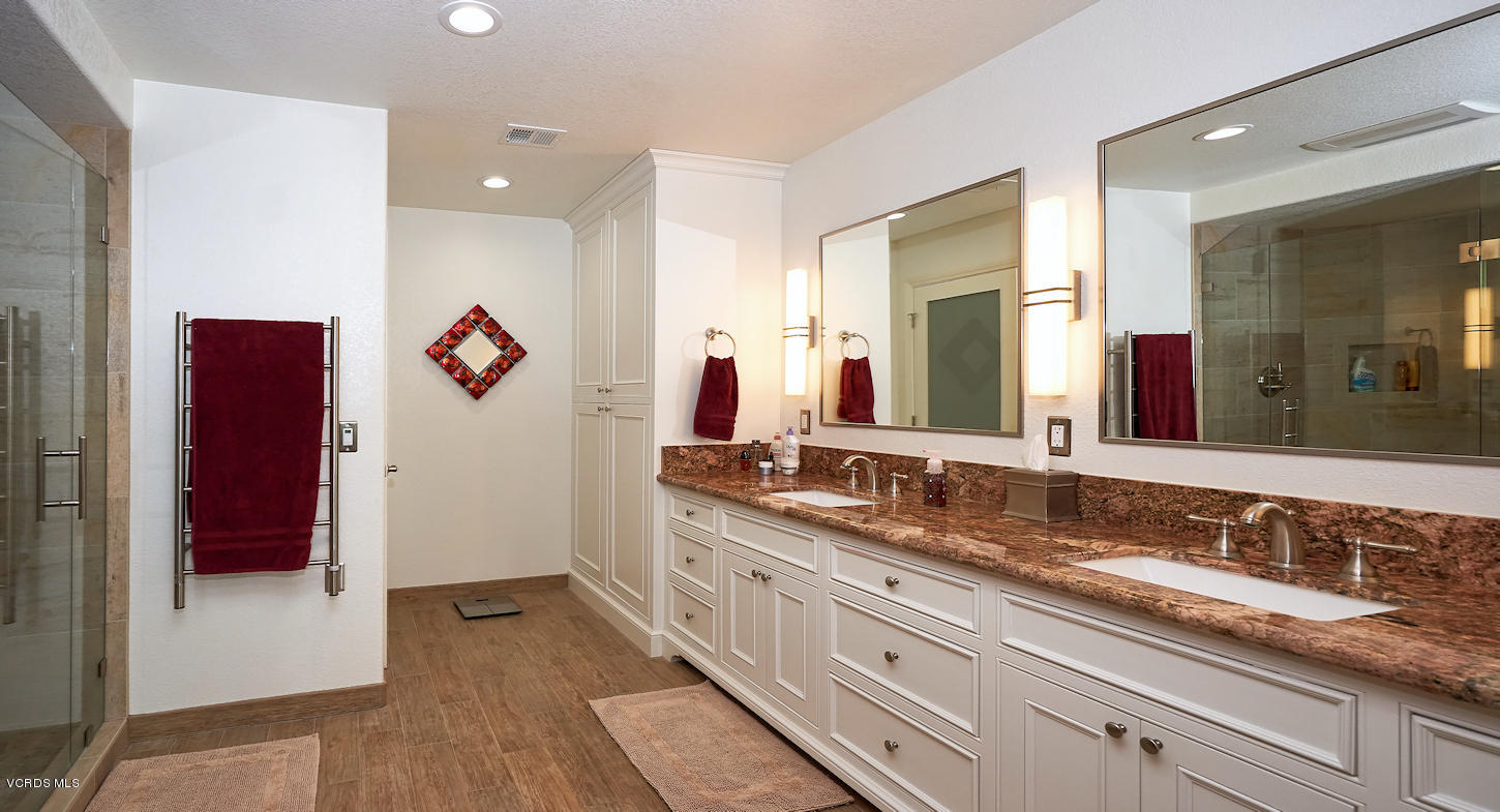 660 Via Con Dios Camarillo, CA 93010 - Photo 25 of 33 a bathroom with a granite countertop double vanity sink and a mirror