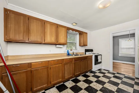 a kitchen with stainless steel appliances a sink and cabinets